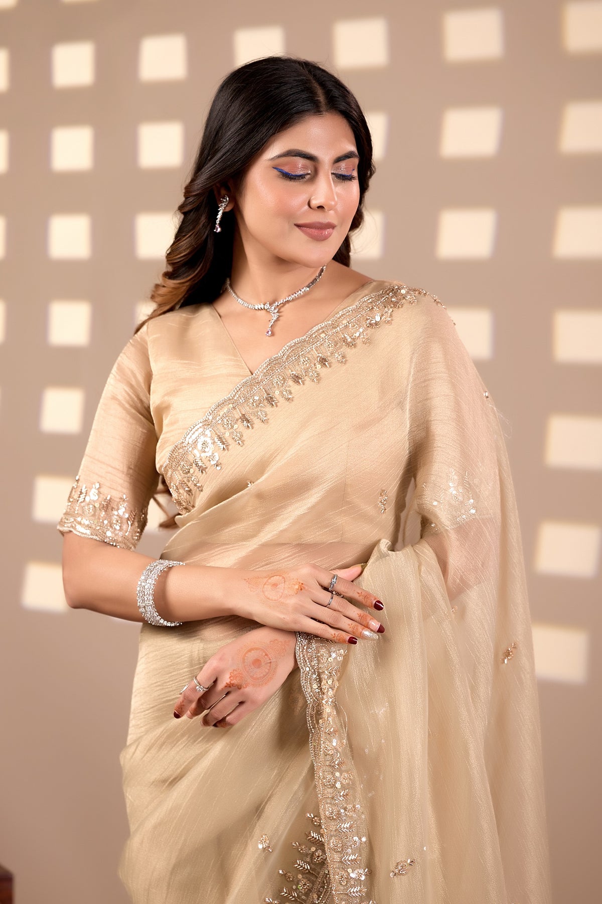 champagne gold soft tissue silk saree with heavy handcrafted beadwork