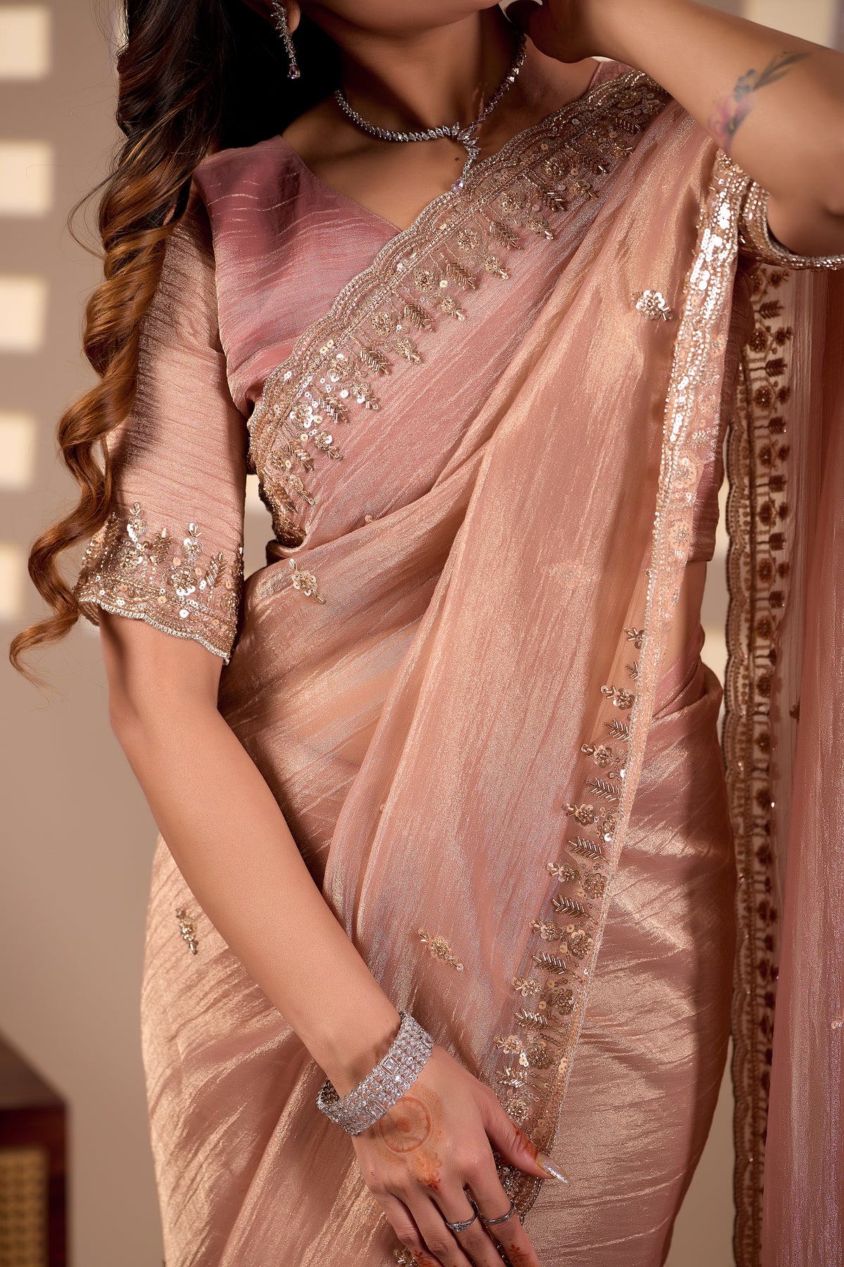 peach champagne soft tissue silk saree with heavy handcrafted beadwork