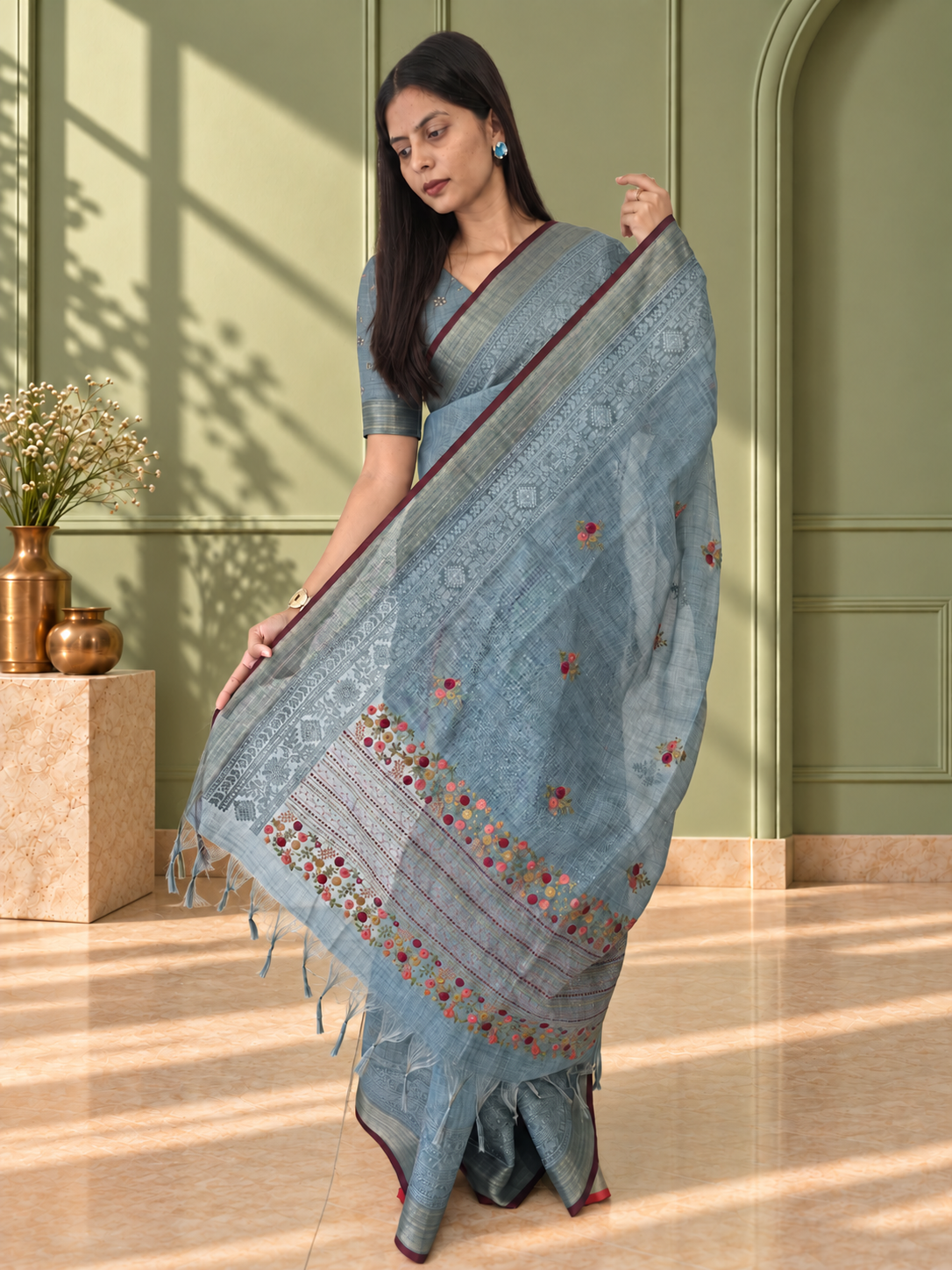 pastel blue linen saree with hand embroidered kantha work