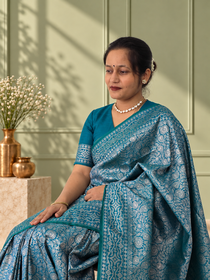 Peacock Blue Crepe Jaal Silk Saree with Matching Floral Border