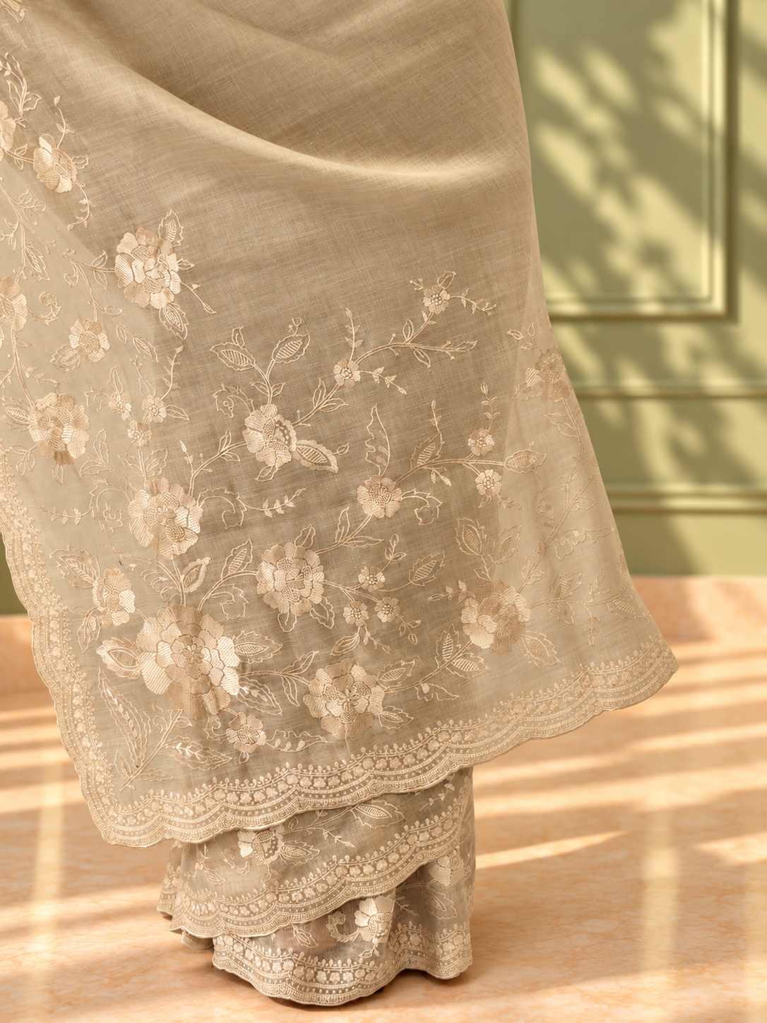 ivory linen tissue cotton saree with intricate floral embroidery