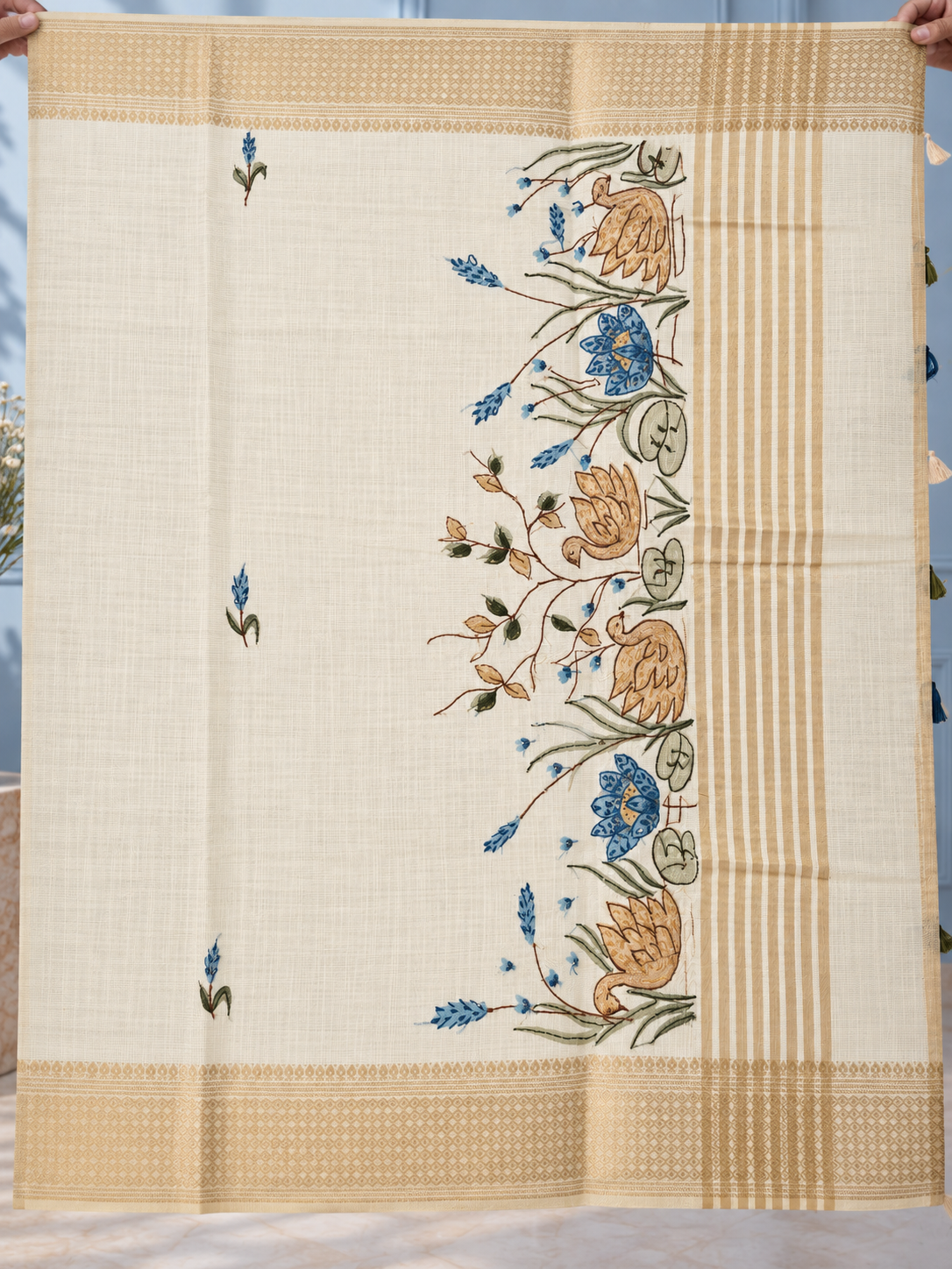 ivory linen saree with hand embroidered peacock blue florals