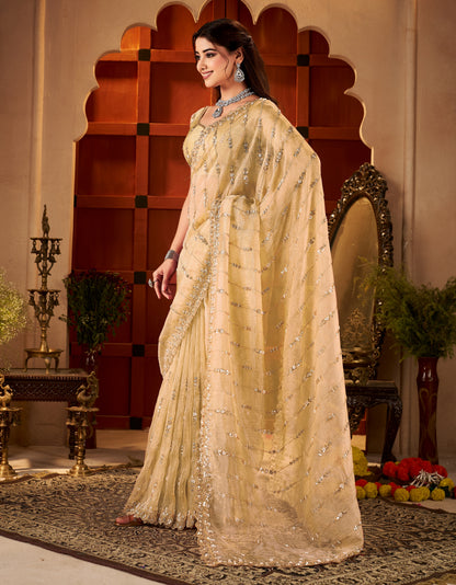Floral scalloped border with hand work on Champagne Gold Tissue Silk Saree