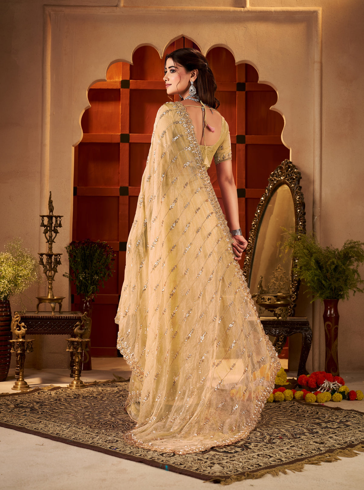 embellished pallu of champagne gold floral tissue silk saree