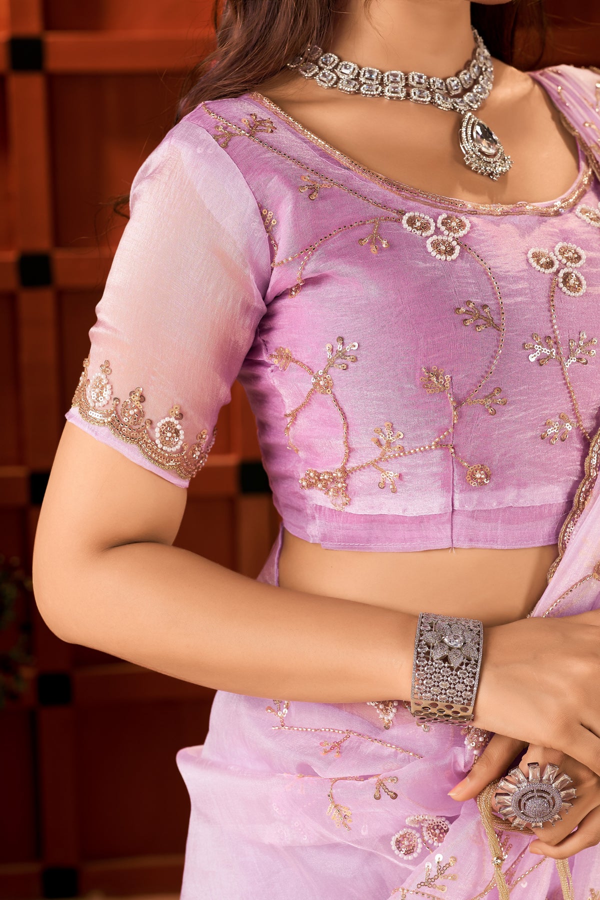 matching blouse with elegant hand work from the chhoga lavender pink tissue silk saree.