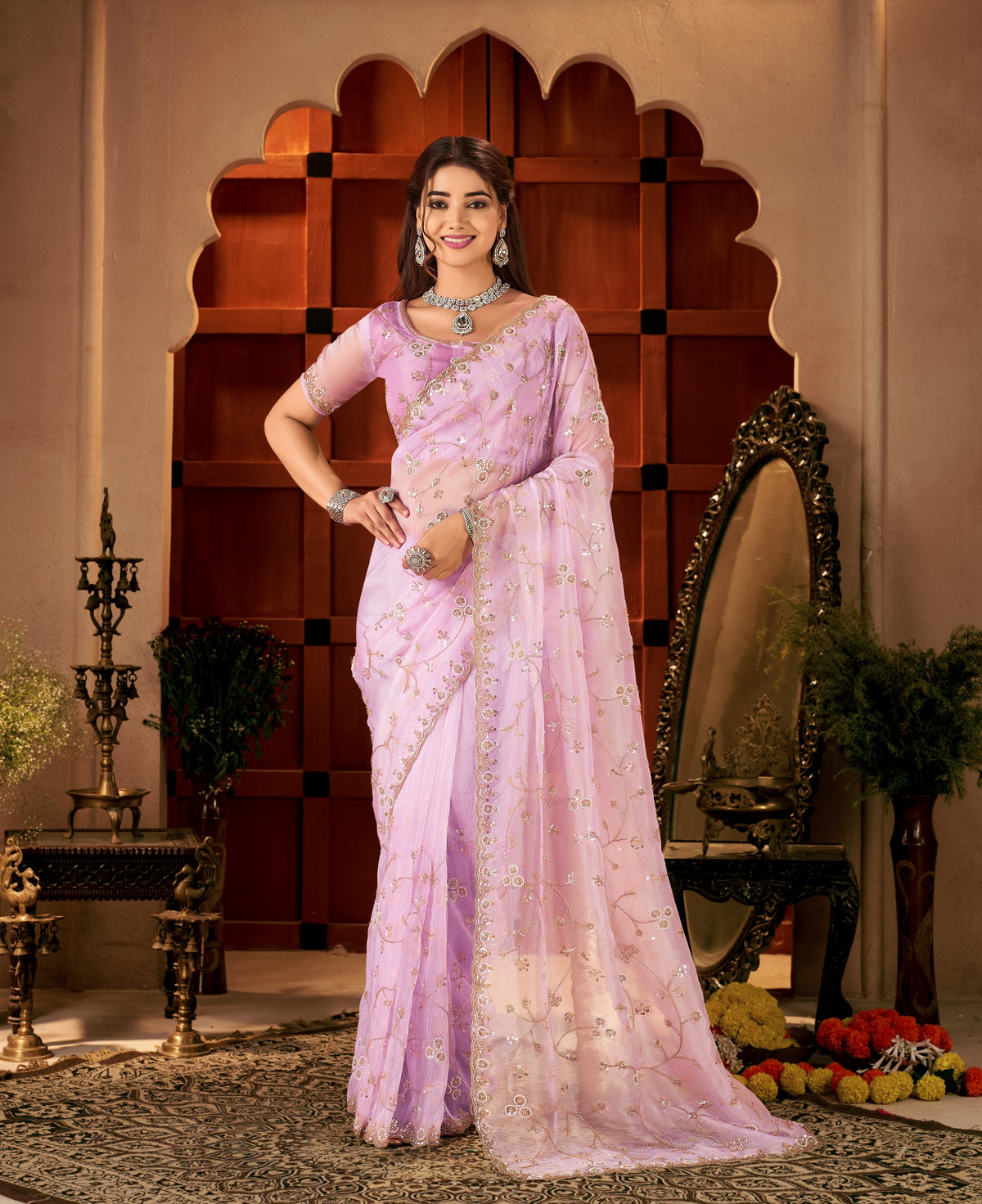 elegant full view of the chhoga lavender pink tissue silk saree styled with a matching hand-work blouse.