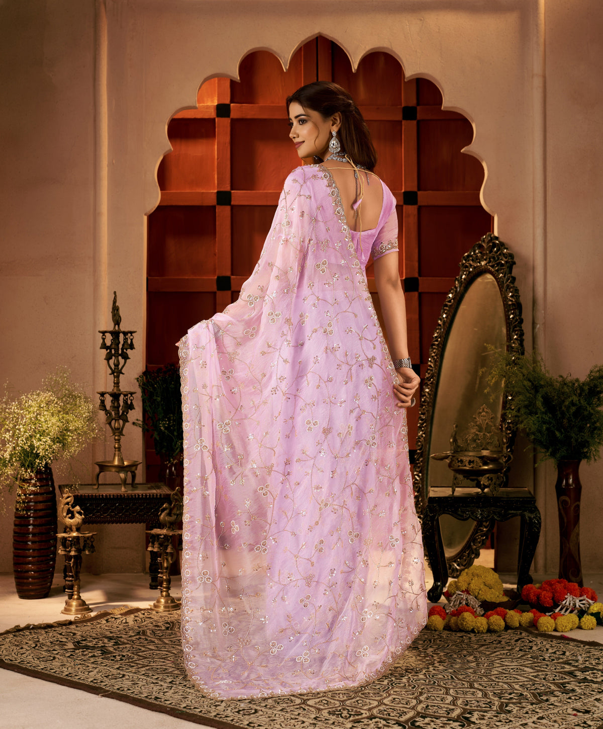 Back view of the Chhoga Lavender Pink Tissue Silk Saree showcasing its elegant drape and intricate hand work.