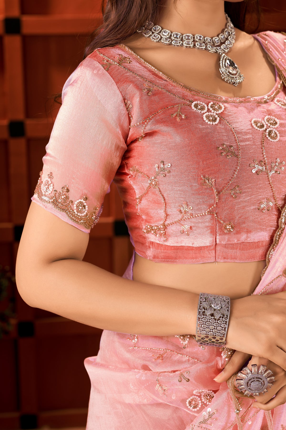 matching blouse with intricate hand work for the chhoga rose pink tissue silk saree.