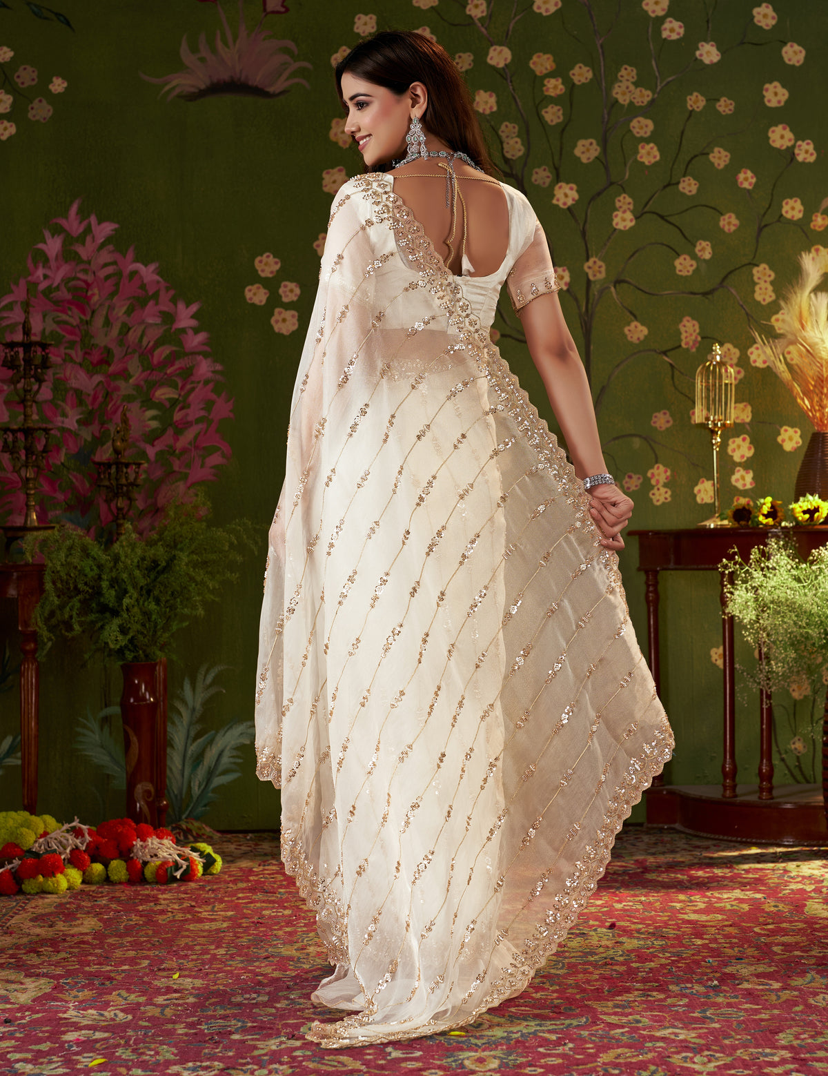 Close-up of floral hand work on the pallu of Ivory White Tissue Silk Saree