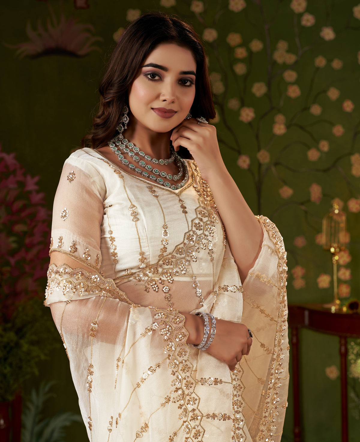 hand work detailing on the sleeve of the ivory white tissue silk blouse