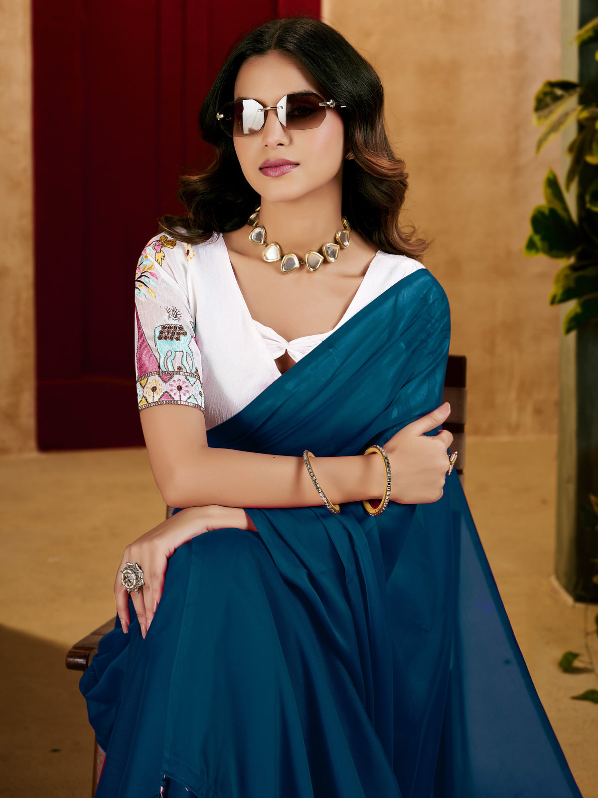 peacock blue elegant plain saree with embroidered blouse