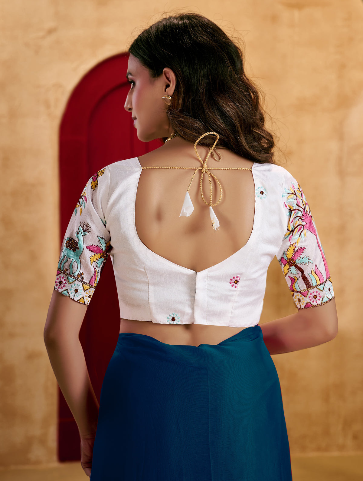 peacock blue elegant plain saree with embroidered blouse
