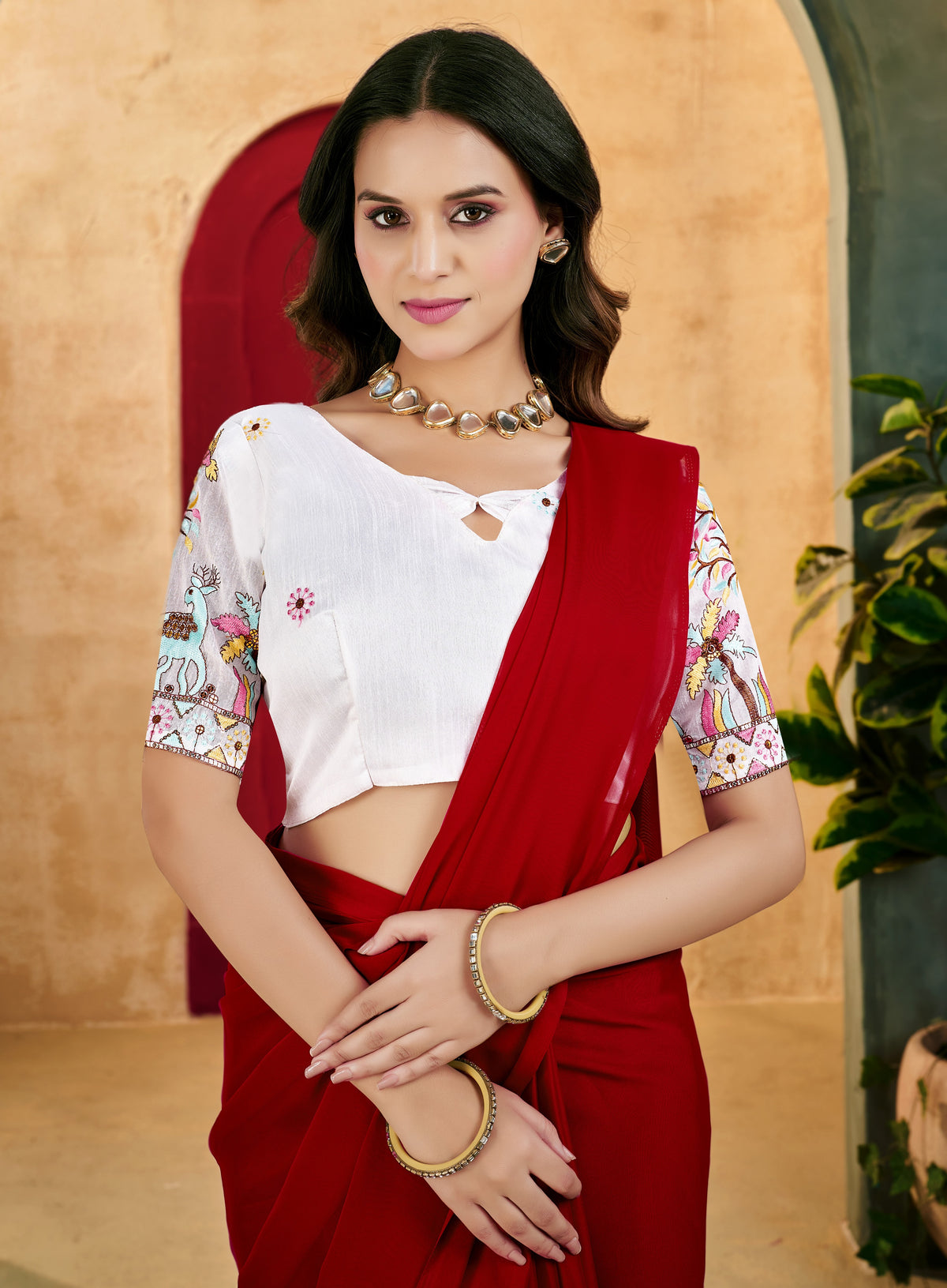 red elegant plain saree with embroidered blouse