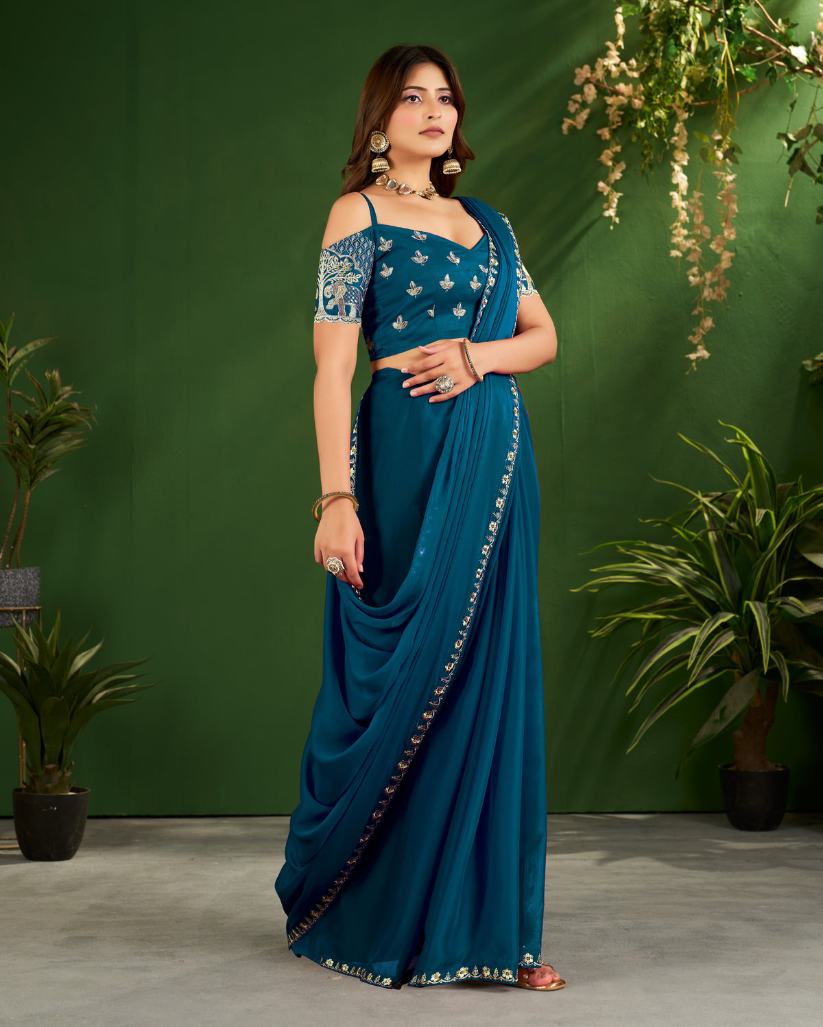 peacock blue rangoli silk saree with embroidered blouse