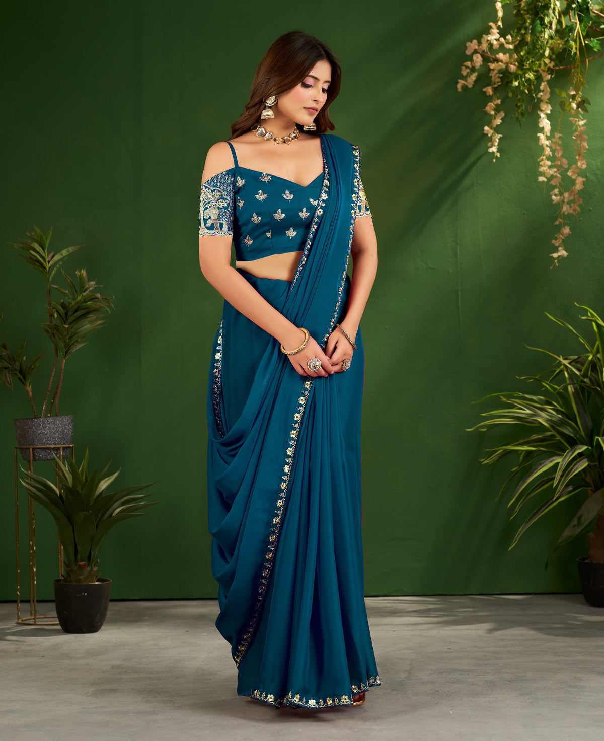 peacock blue rangoli silk saree with embroidered blouse