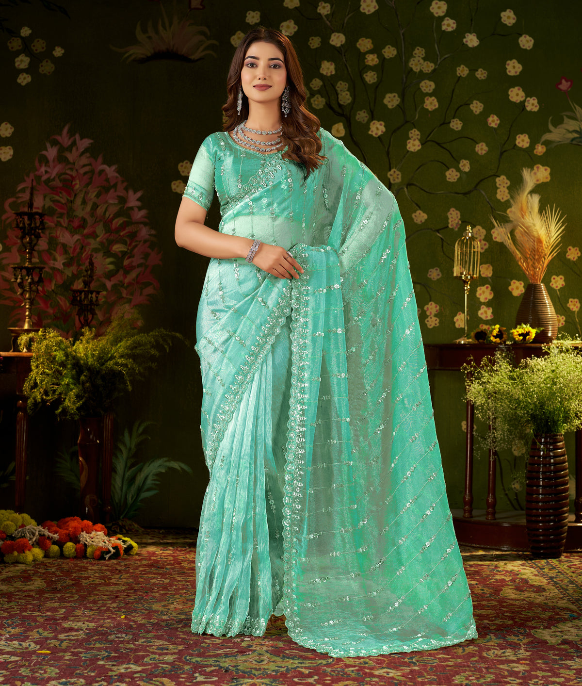 chhoga sea green floral stripe tissue silk saree with hand work and embellished border