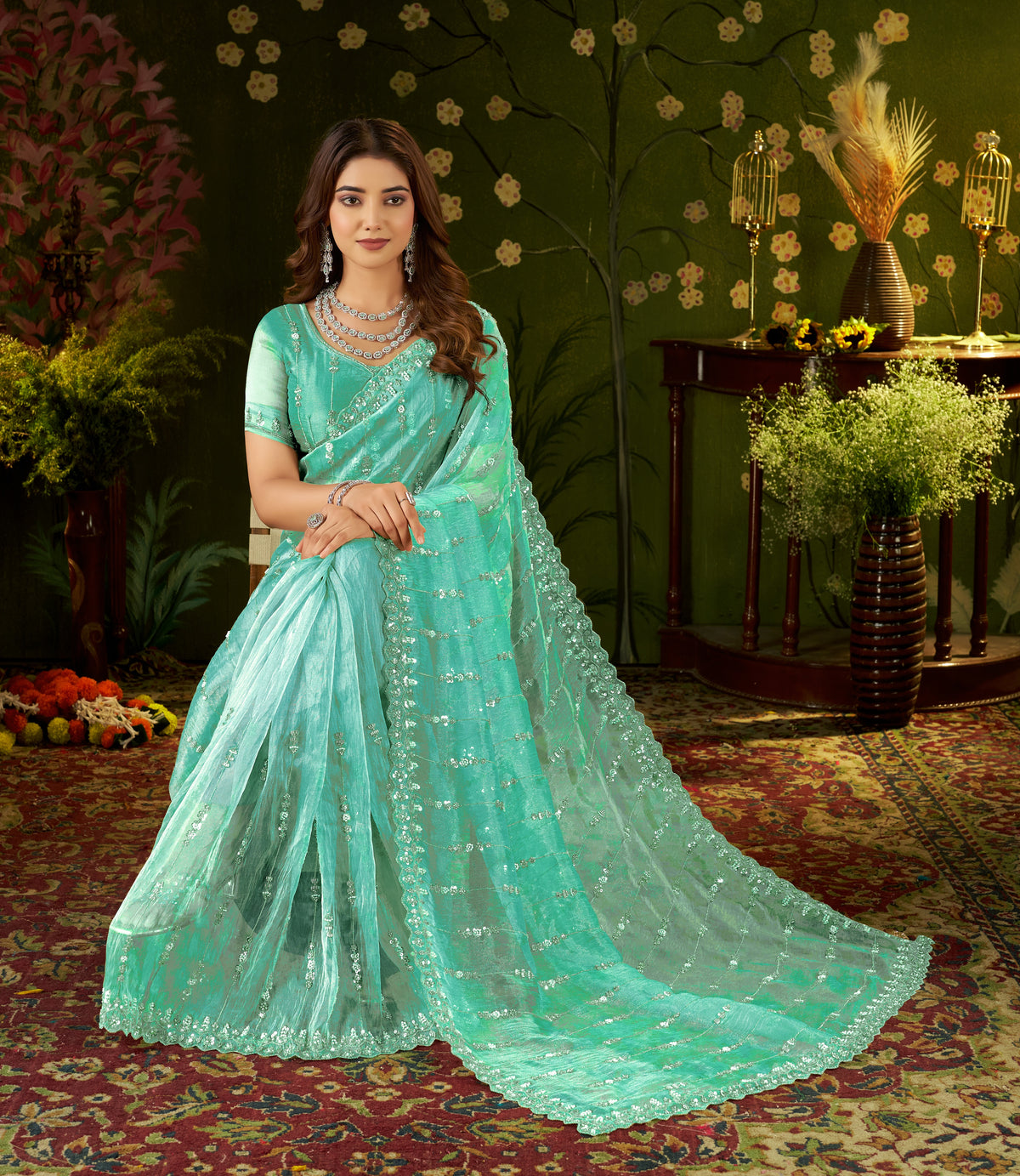 close-up of chhoga sea green tissue silk saree with intricate hand work