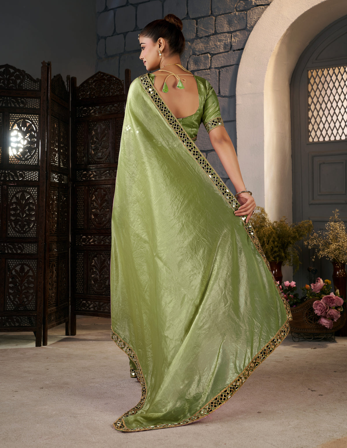 pistachio green crush tissue silk saree with artisan mirror border