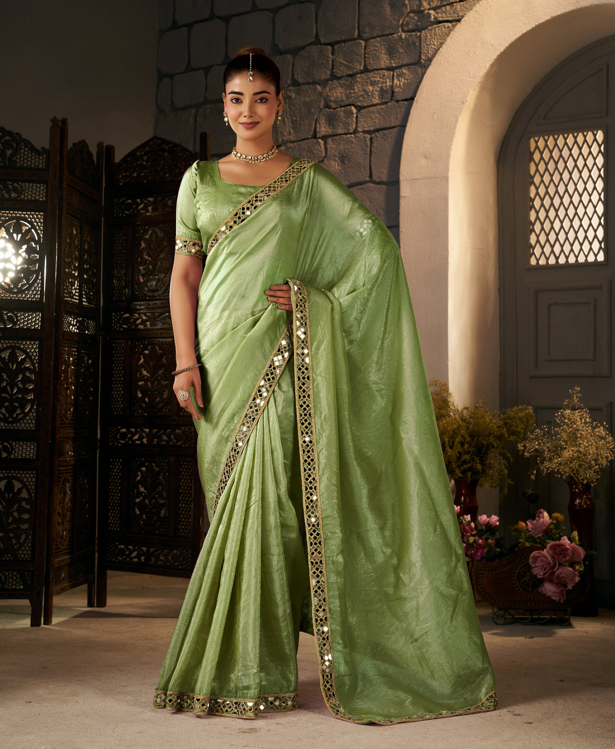 pistachio green crush tissue silk saree with artisan mirror border