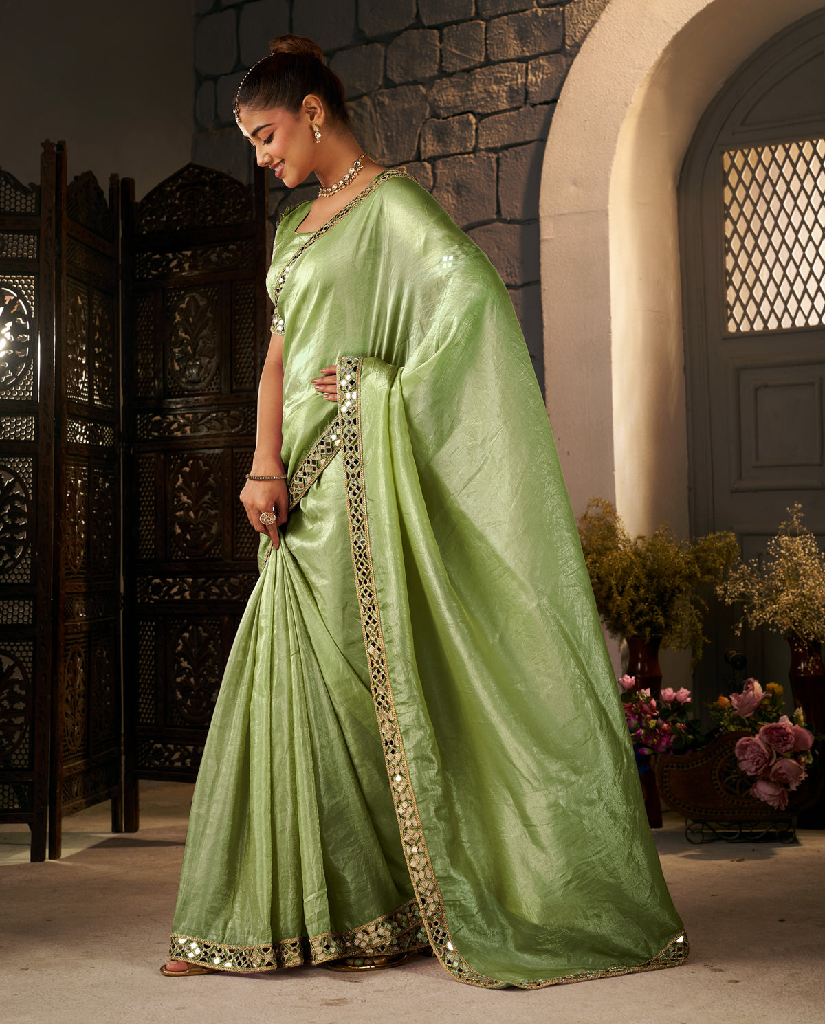 pistachio green crush tissue silk saree with artisan mirror border
