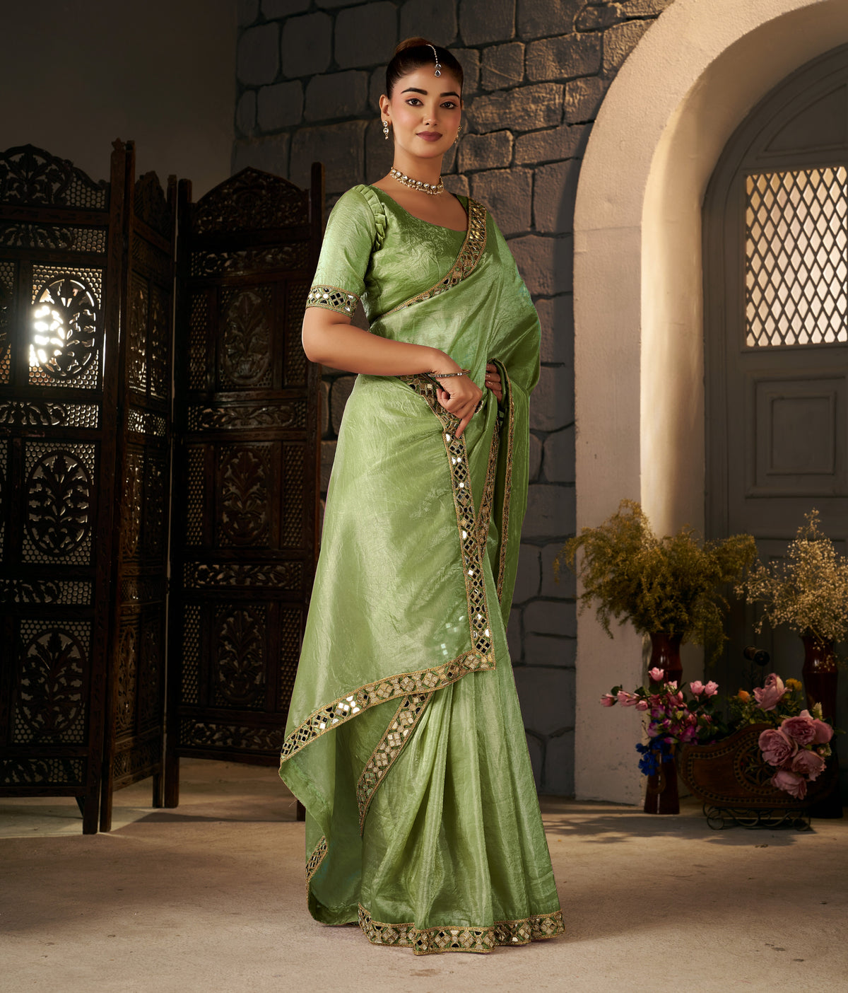 pistachio green crush tissue silk saree with artisan mirror border