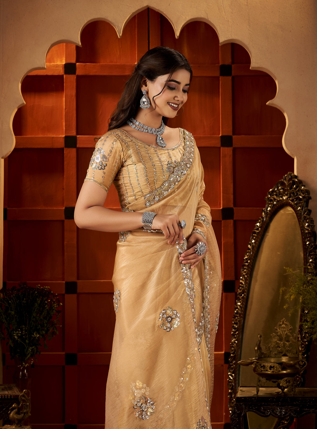 chhoga champagne gold floral motif saree side profile highlighting graceful drape