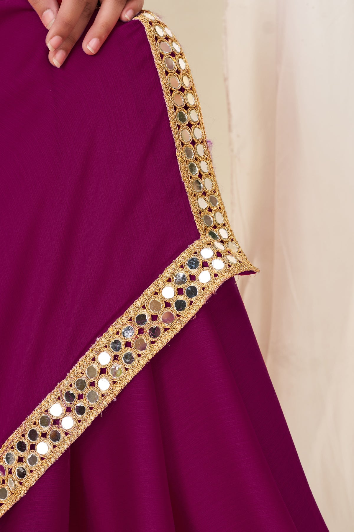 Close-up of gold mirror work on Chiffon Silk Deep Magenta Saree