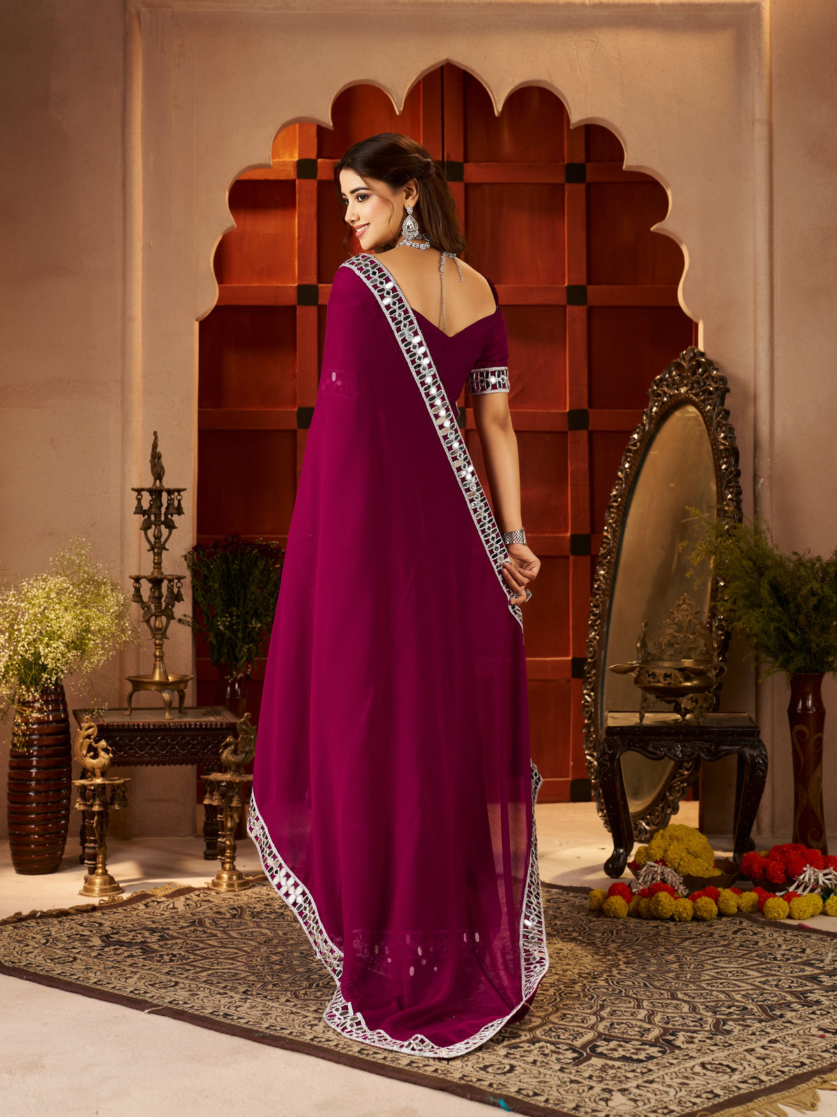 Pallu detail of Chiffon Silk Deep Magenta Saree with Silver Mirror Embellished Border