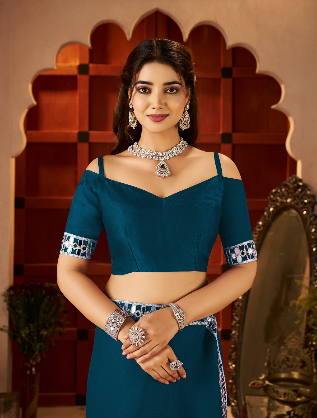 matching blouse front with chiffon silk peacock blue saree