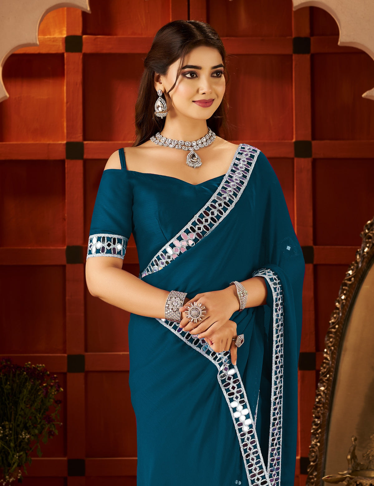 silver mirror embellished border detail on chiffon silk peacock blue saree