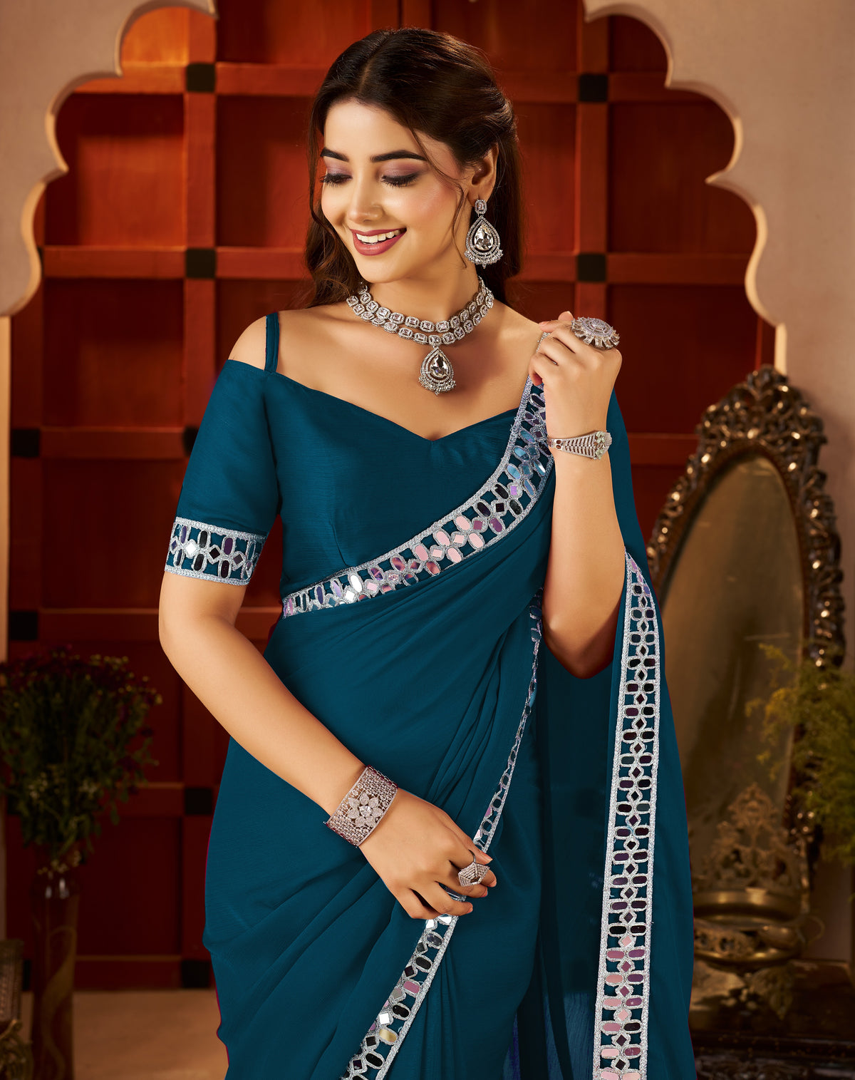 Chiffon Silk Peacock Blue Saree styled for festive wear