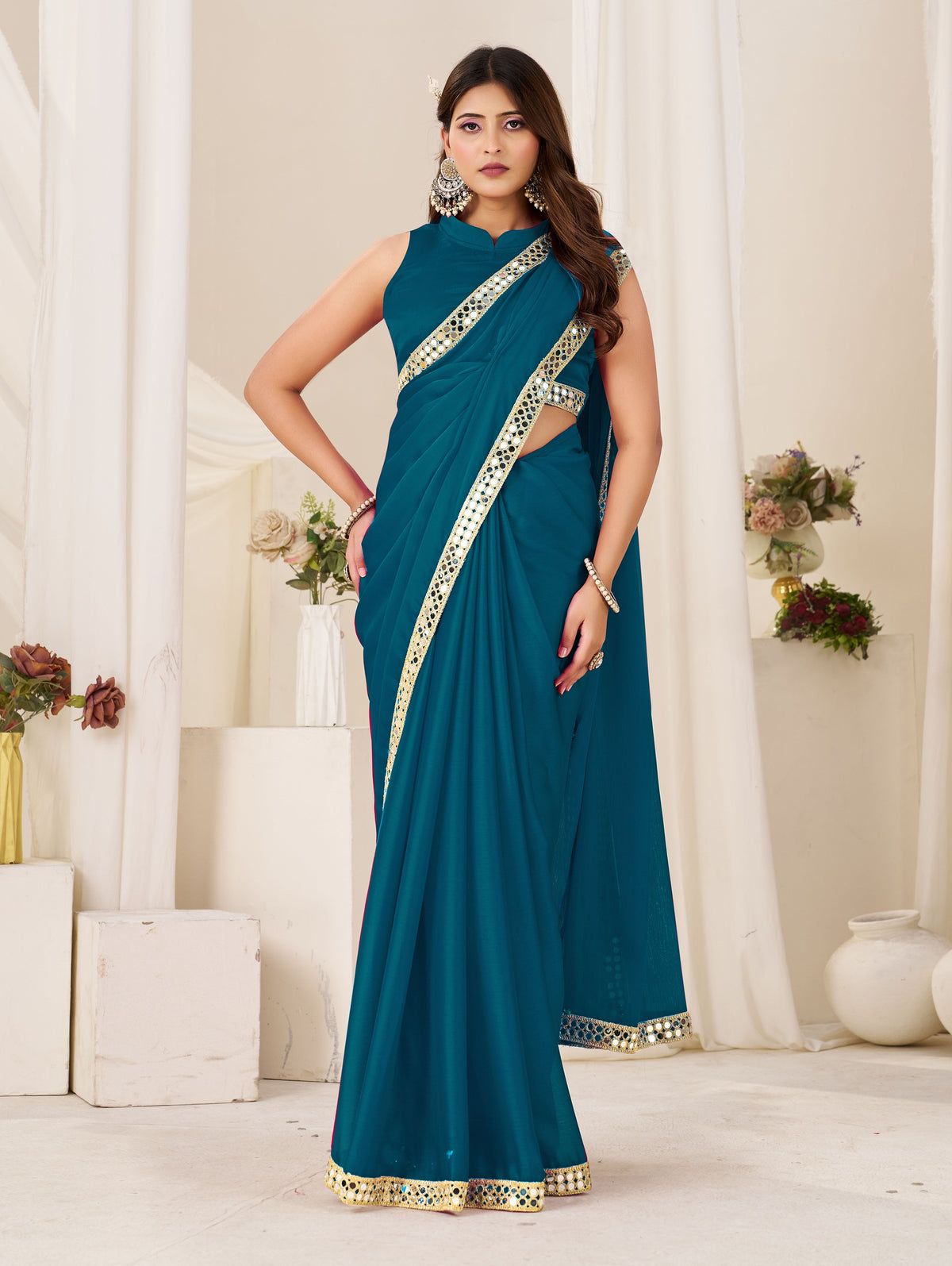 chiffon silk peacock blue saree with gold mirror border front view by chhoga