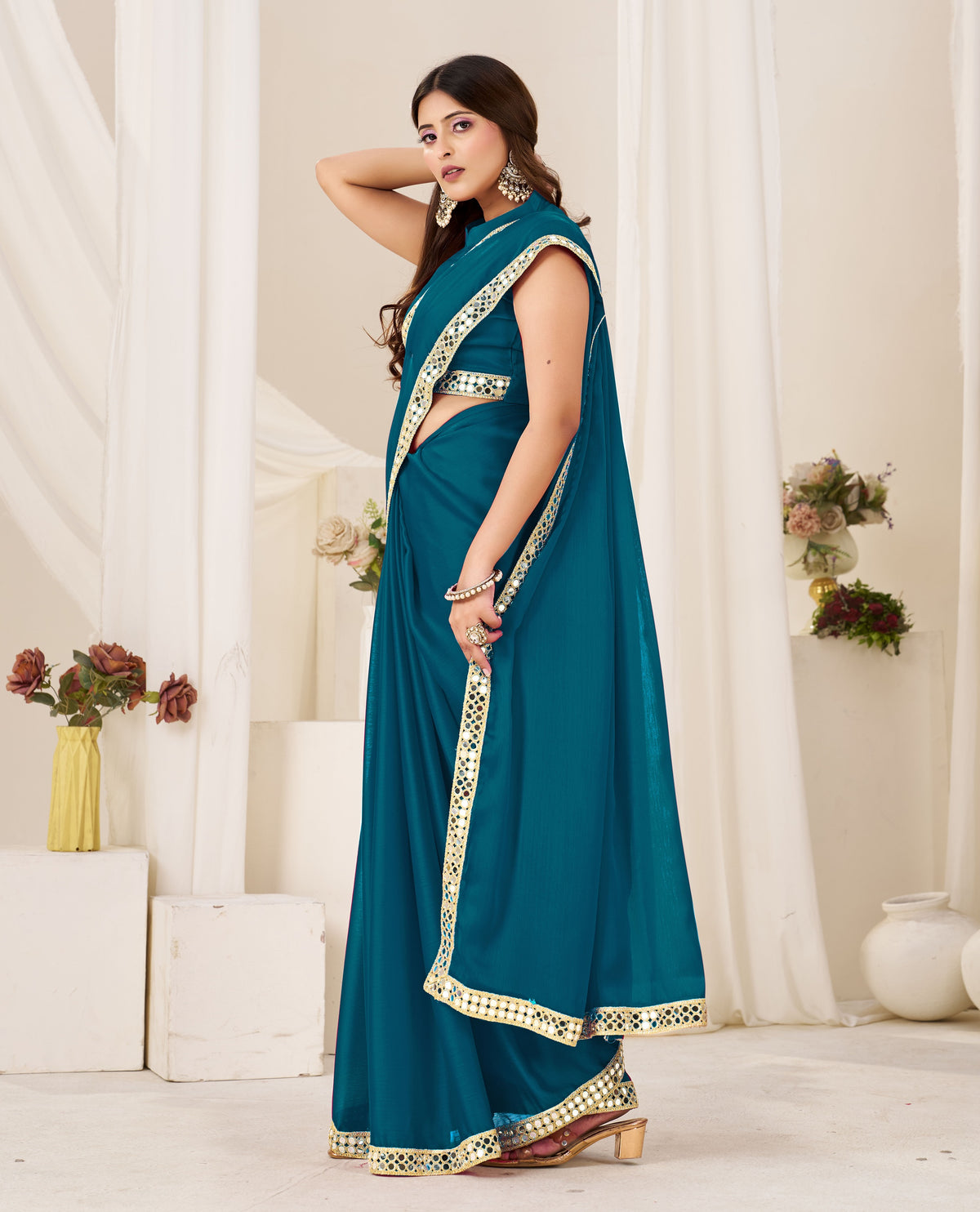Side view of Chiffon Silk Peacock Blue Saree with Gold Mirror Border
