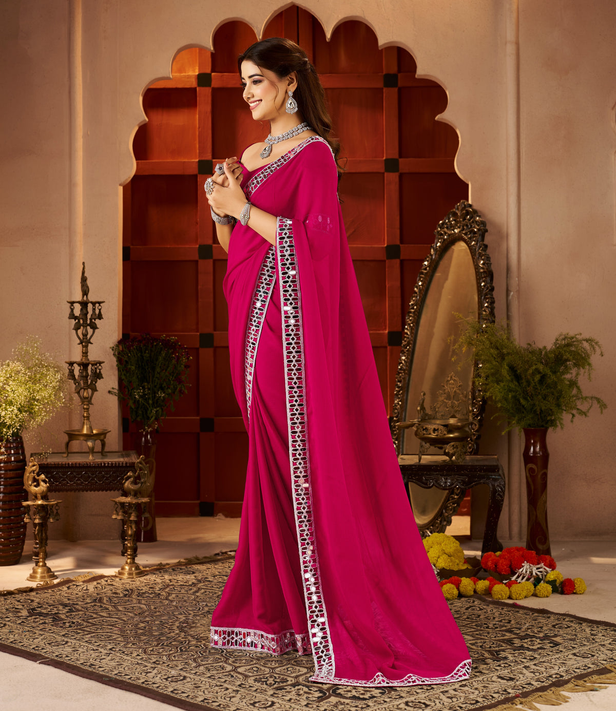 side view of chiffon silk pink saree with mirror embellished border