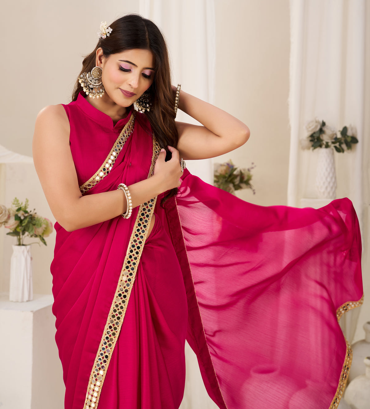 pleats view of chiffon silk pink saree with gold mirror border