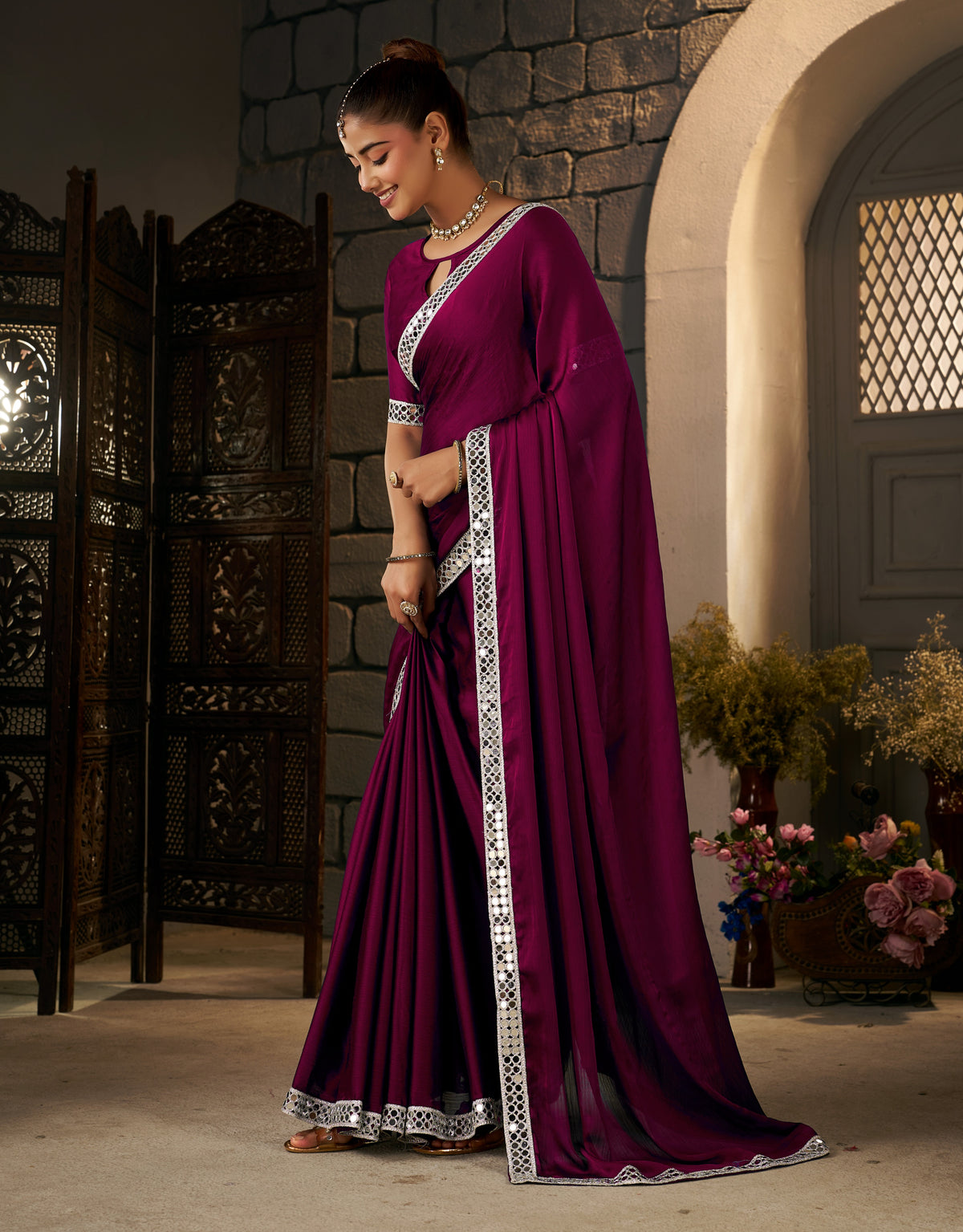 pleats view of deep magenta ethnic saree with silver mirror work