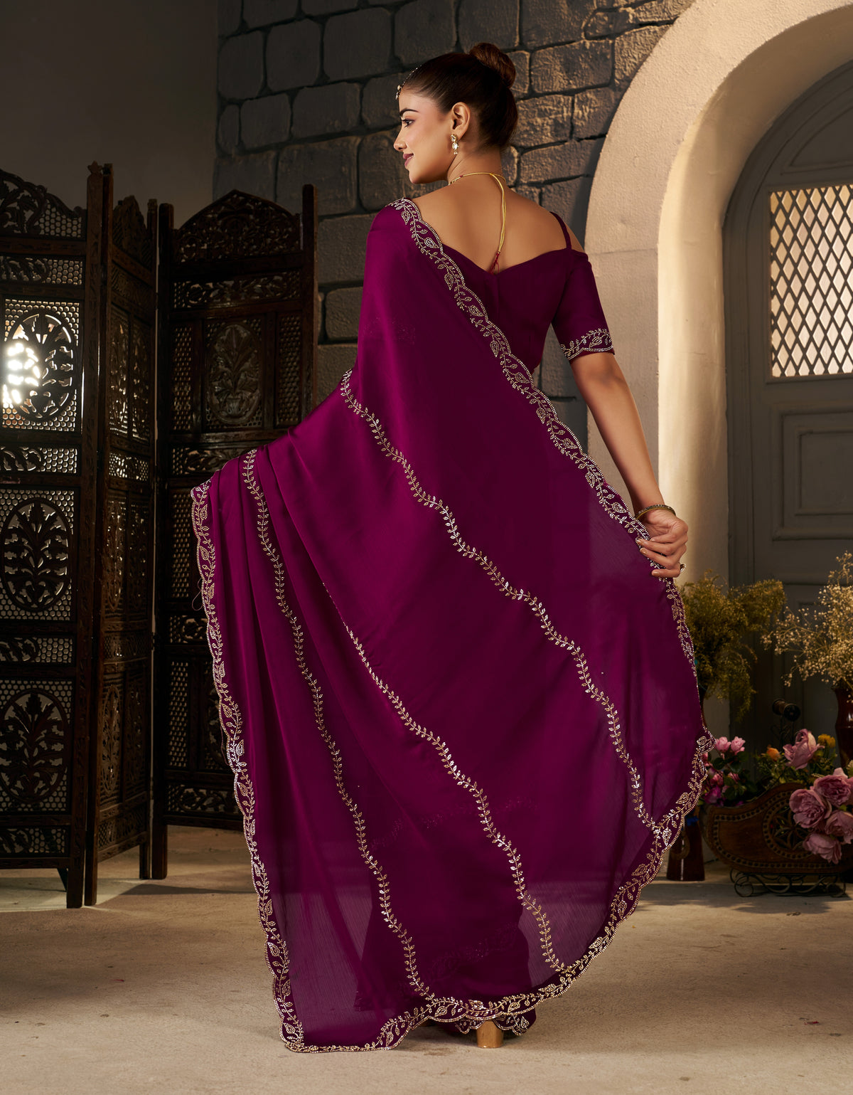 Elegant pallu of the Deep Magenta Silver Stonework Designer Saree with shimmering silver embellishments.
