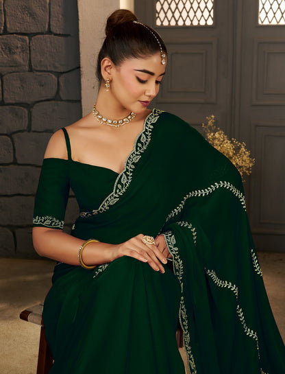 Half view of the Emerald Green Gold Stonework Designer Saree highlighting its graceful drape.