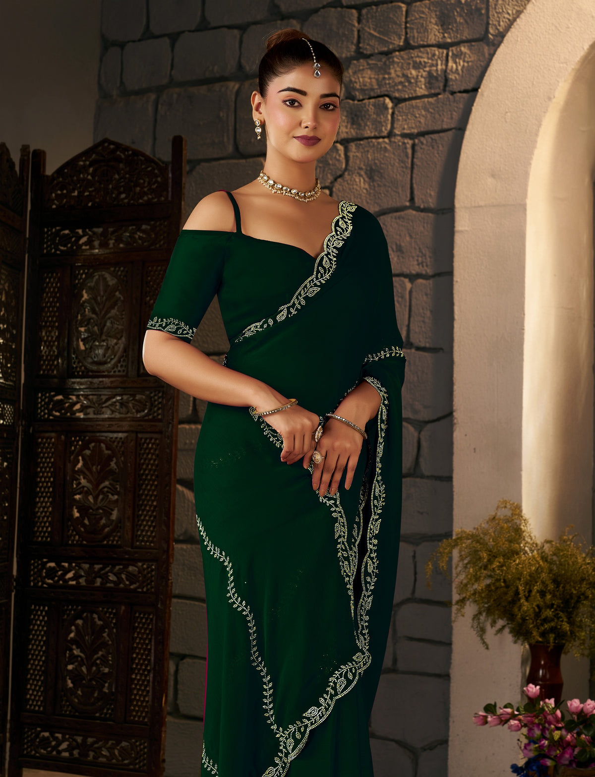 Emerald Green Gold Stonework Designer Saree styled for parties and receptions.
