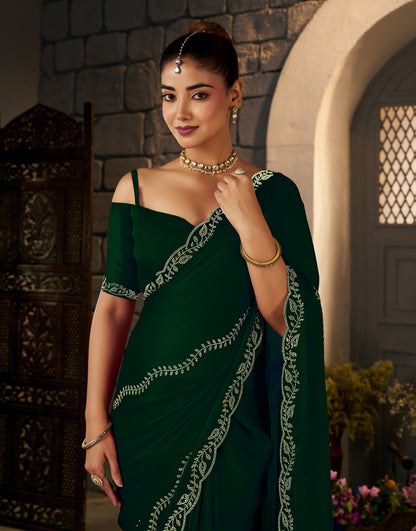 Intricate gold stonework embellishments on the Emerald Green Gold Stonework Designer Saree.