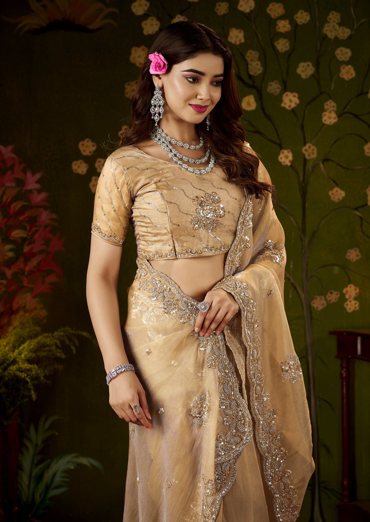 close-up of intricate handcrafted bead work on the champagne gold regal bloom soft tissue saree.