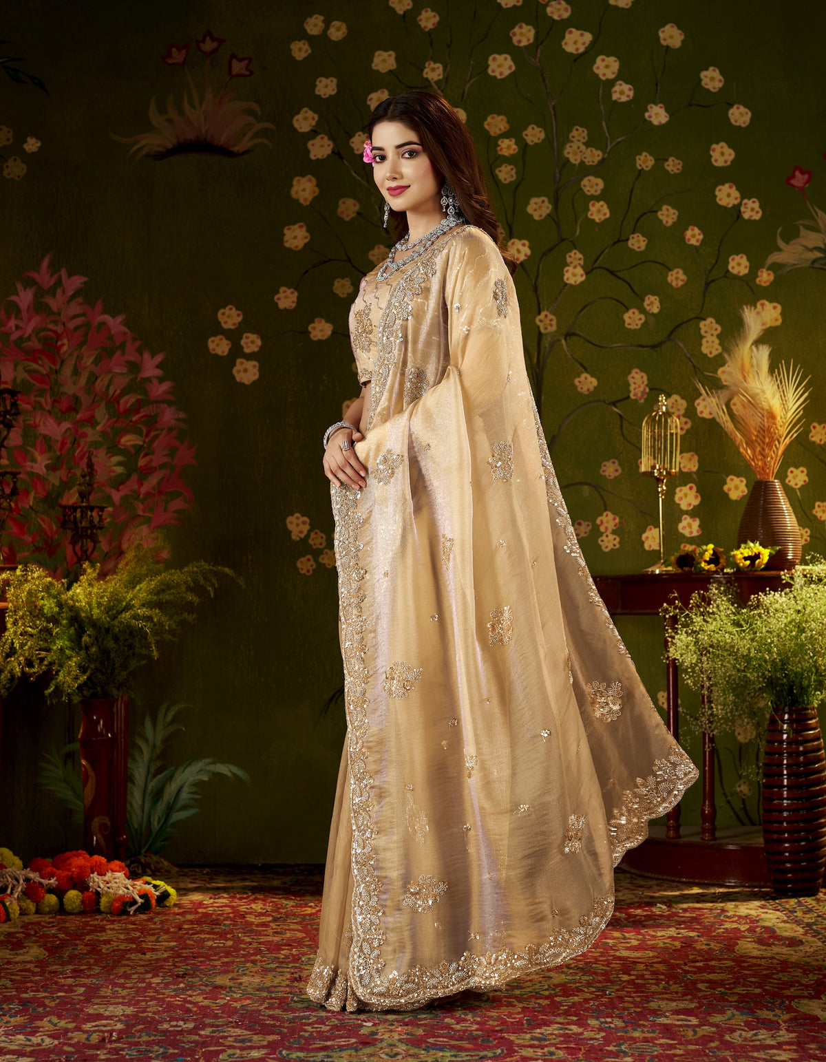 detailed handcrafted embroidery on the champagne gold regal bloom soft tissue saree.
