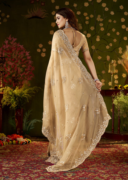 Detailed pallu of Handcrafted Champagne Gold Regal Bloom Soft Tissue Saree with handcrafted floral work.