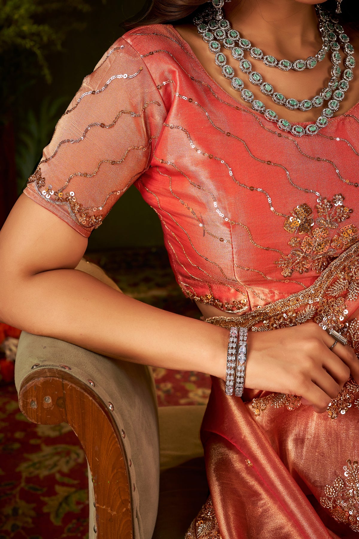 designer blouse front of handcrafted peach coral regal bloom soft tissue saree.