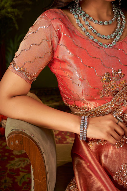 Designer blouse front of Handcrafted Peach Coral Regal Bloom Soft Tissue Saree.