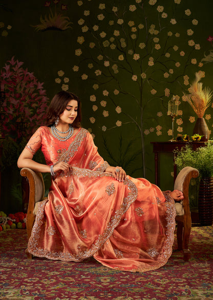 Complete look of Handcrafted Peach Coral Regal Bloom Soft Tissue Saree with designer blouse.