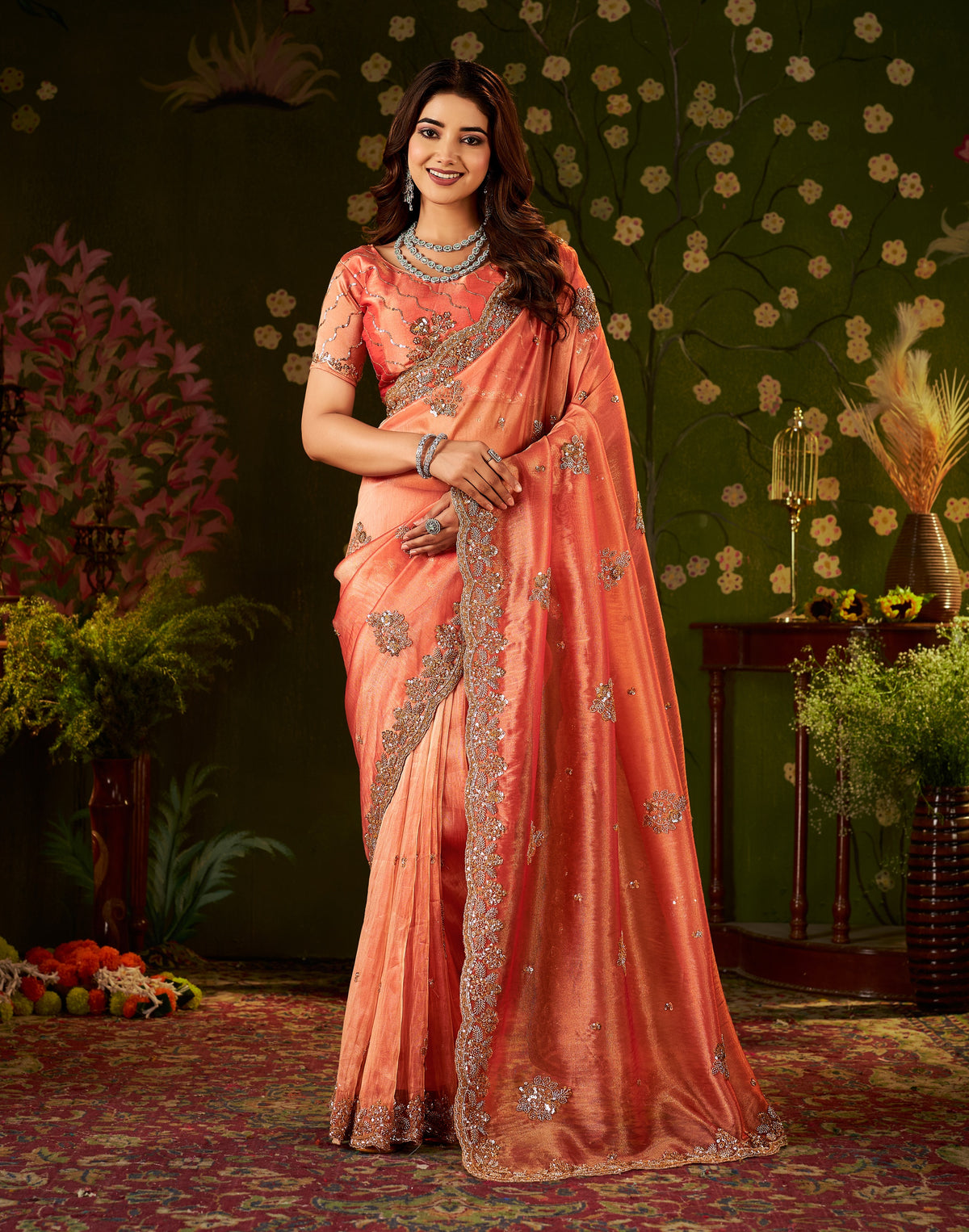 designer front style of handcrafted peach coral regal bloom soft tissue saree.