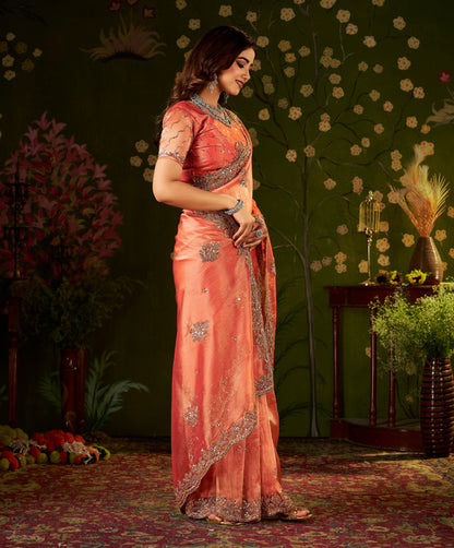 Detailed pallu of Handcrafted Peach Coral Regal Bloom Soft Tissue Saree with floral embellishments.
