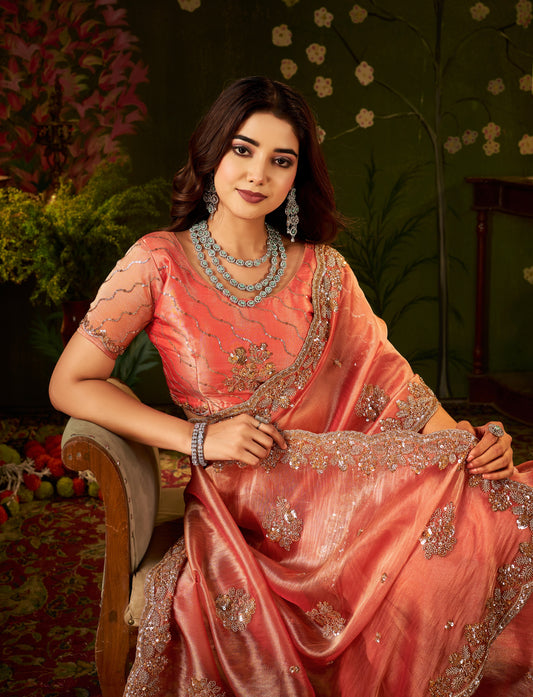 Stylish look of Handcrafted Peach Coral Regal Bloom Soft Tissue Saree.