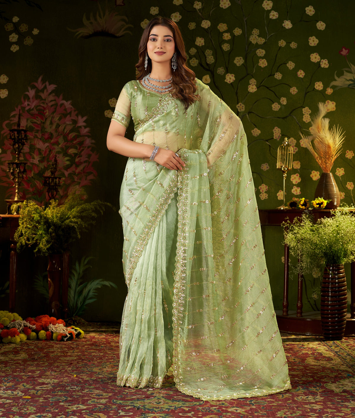 Full spread view of pistachio green saree pallu featuring floral stripe beads and handwork.